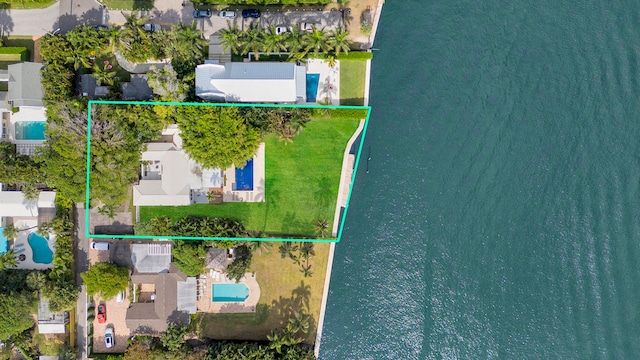 birds eye view of property featuring a water view