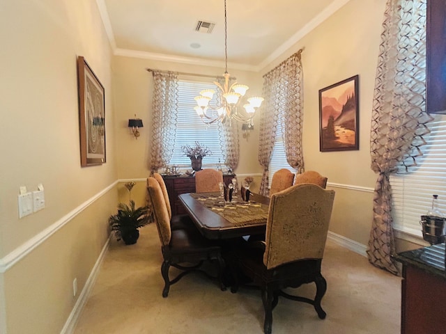 carpeted dining room featuring a chandelier and crown molding