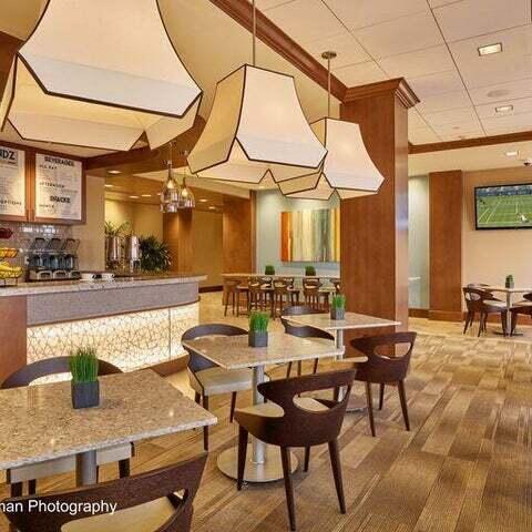 dining room with hardwood / wood-style floors and a paneled ceiling