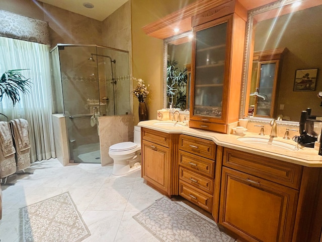 bathroom with toilet, vanity, an enclosed shower, and tile patterned flooring