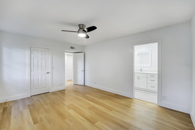 unfurnished bedroom with light wood-type flooring, connected bathroom, a closet, and ceiling fan