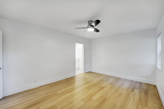 spare room featuring light hardwood / wood-style floors and ceiling fan