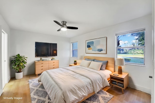 bedroom featuring ceiling fan and light hardwood / wood-style flooring