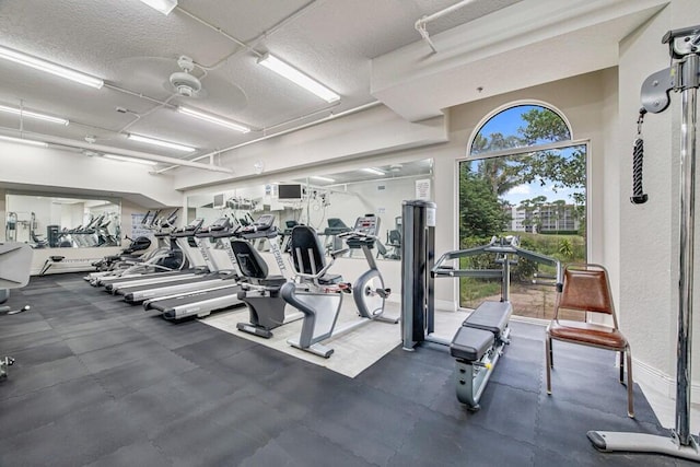 gym featuring a textured ceiling