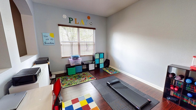 game room with dark hardwood / wood-style flooring