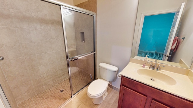 bathroom with an enclosed shower, vanity, and toilet