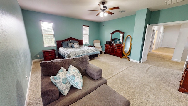 bedroom featuring ceiling fan and light colored carpet