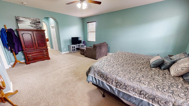 bedroom with light carpet and ceiling fan