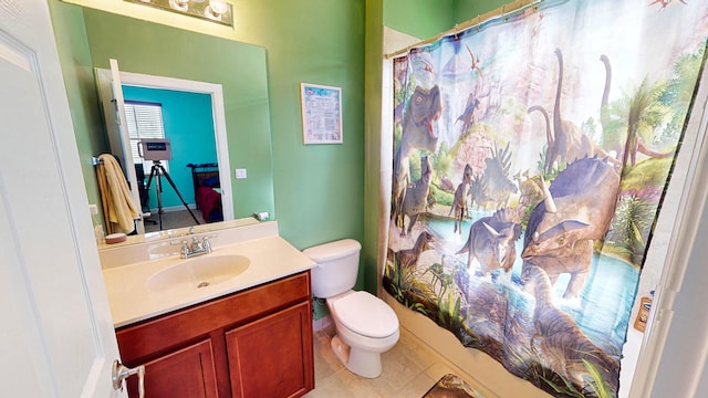 full bathroom featuring tile patterned flooring, vanity, toilet, and shower / tub combo