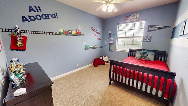 bedroom featuring ceiling fan and carpet