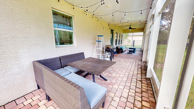 view of patio / terrace featuring area for grilling, ceiling fan, and an outdoor hangout area