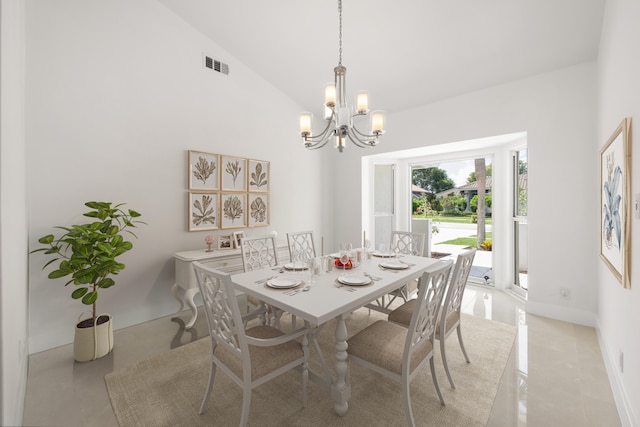 dining room featuring high vaulted ceiling and an inviting chandelier