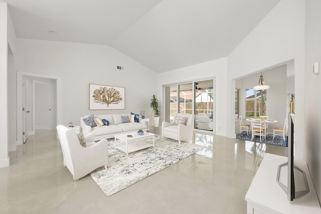 living room featuring high vaulted ceiling