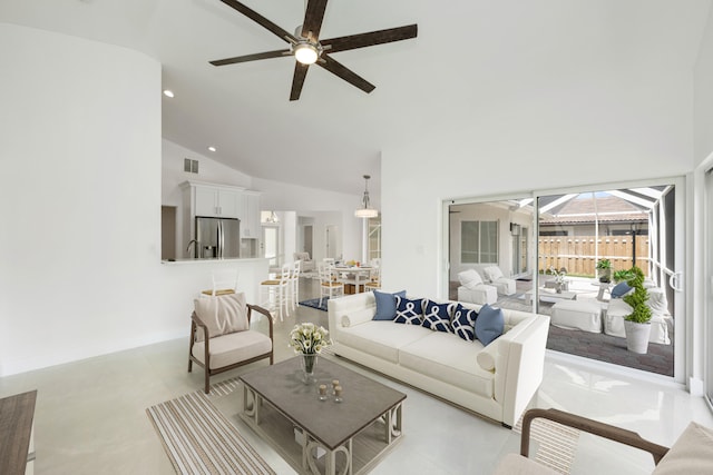 living room featuring high vaulted ceiling and ceiling fan