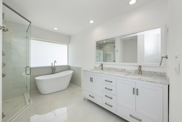 bathroom with vanity and separate shower and tub