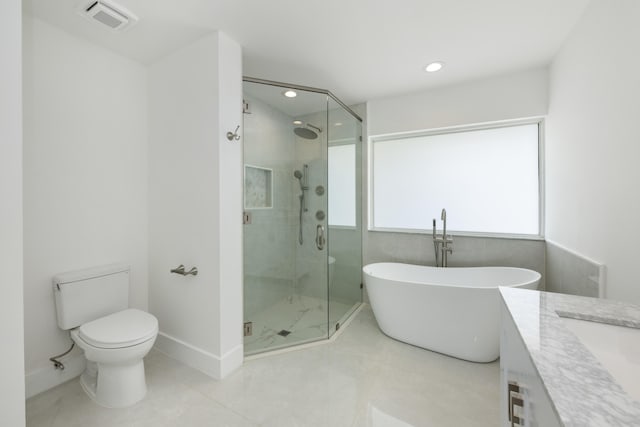 full bathroom with tile patterned floors, vanity, toilet, and shower with separate bathtub