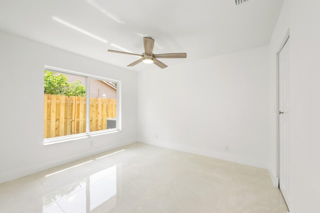 unfurnished room with ceiling fan