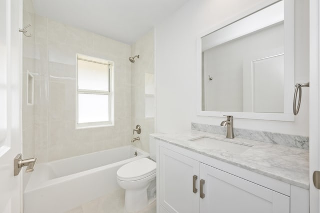 full bathroom with vanity, toilet, and tiled shower / bath