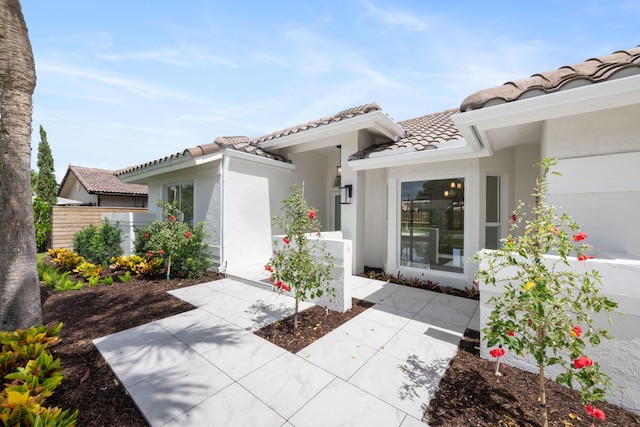 doorway to property with a patio area