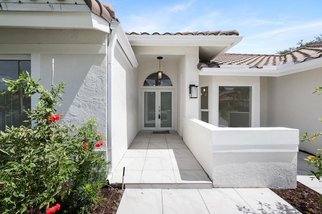 property entrance featuring french doors