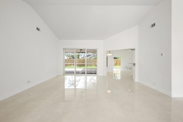 empty room featuring ceiling fan and high vaulted ceiling