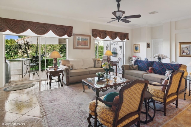 living room featuring ceiling fan and ornamental molding