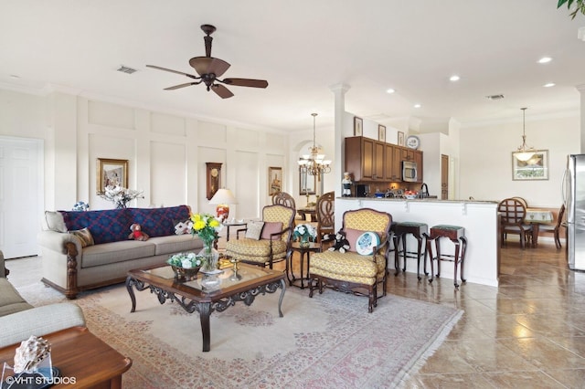 living room with ceiling fan with notable chandelier and ornamental molding