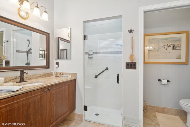 bathroom featuring tile patterned floors, toilet, an enclosed shower, and vanity