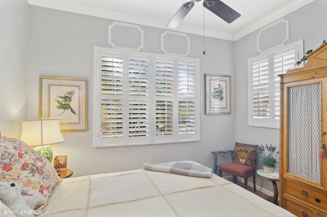 bedroom featuring ceiling fan, crown molding, and multiple windows