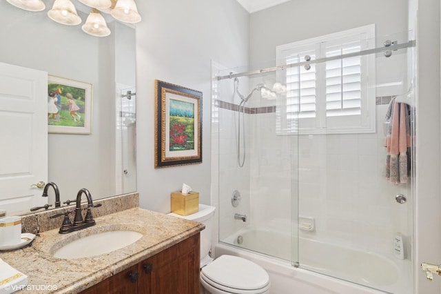 full bathroom with vanity, combined bath / shower with glass door, and toilet