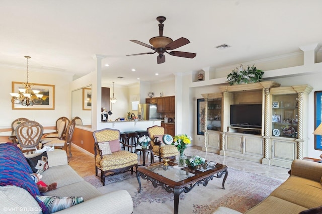 living room featuring ceiling fan with notable chandelier and crown molding