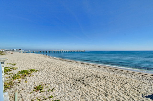 property view of water featuring a beach view