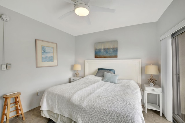 tiled bedroom with ceiling fan