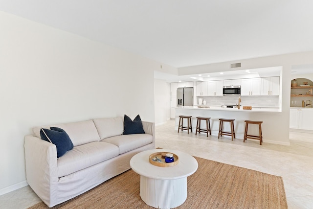 living room with light tile patterned floors