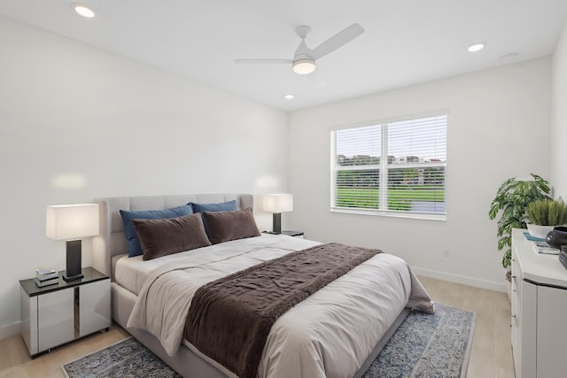 bedroom featuring ceiling fan and light wood-type flooring