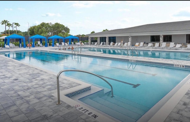 view of swimming pool featuring a gazebo