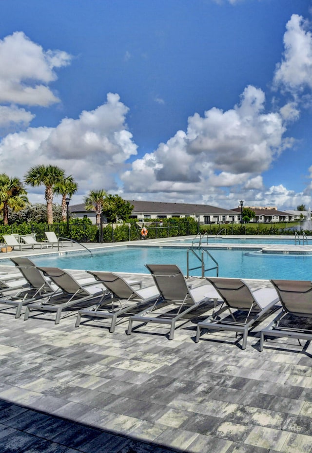 view of swimming pool with a patio