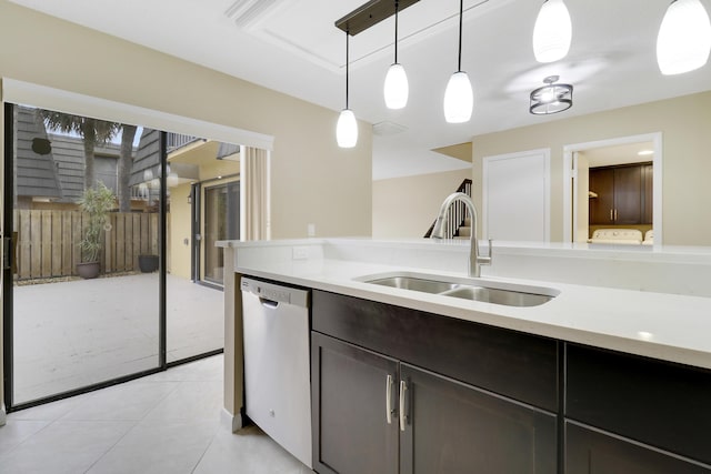 kitchen featuring dishwasher, hanging light fixtures, dark brown cabinetry, light tile patterned flooring, and sink