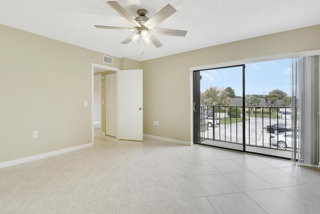 unfurnished room featuring light tile patterned flooring and ceiling fan