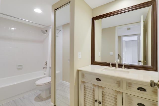 full bathroom with toilet, vanity, and tiled shower / bath combo