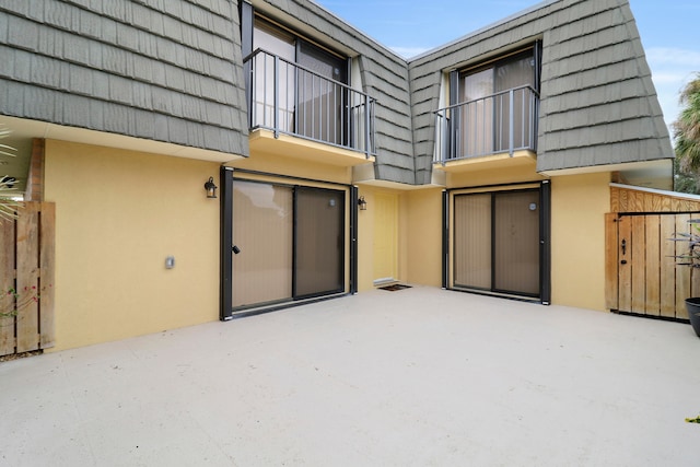 rear view of property featuring a patio