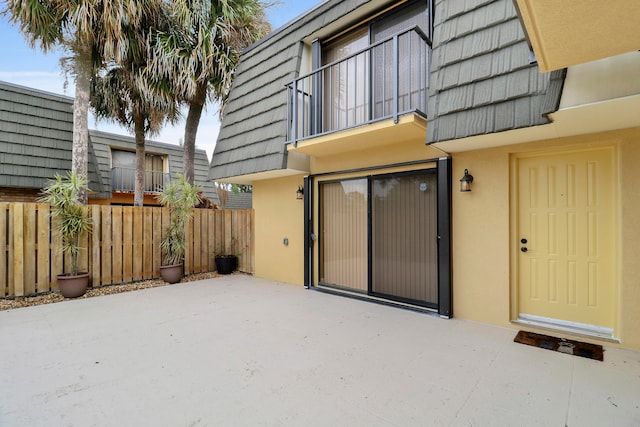 exterior space featuring a balcony and a patio