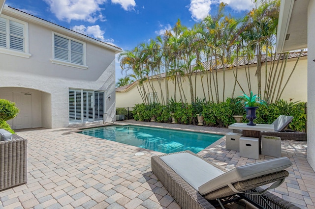 view of pool featuring a patio area