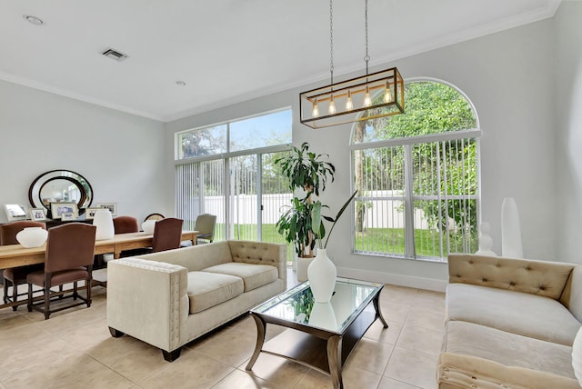 living room featuring a wealth of natural light, light tile patterned floors, and an inviting chandelier