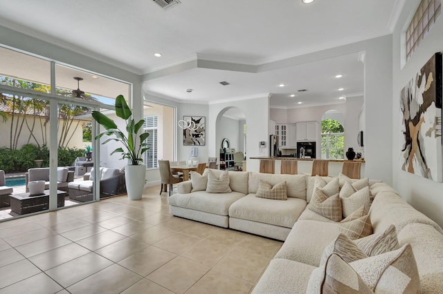 tiled living room featuring ornamental molding