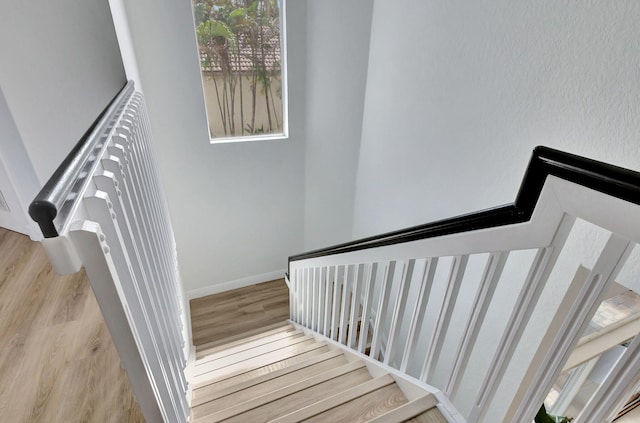 stairway with wood-type flooring