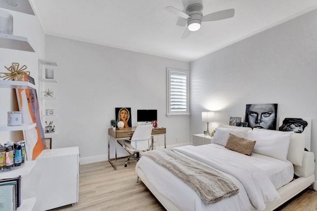 bedroom with light wood-type flooring, ceiling fan, and crown molding