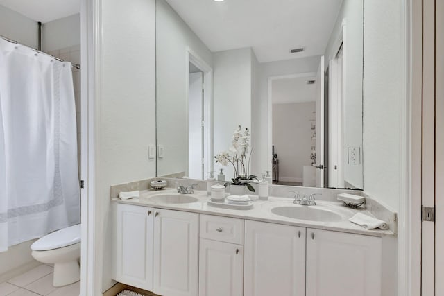 full bathroom with vanity, shower / bath combo, tile patterned flooring, and toilet