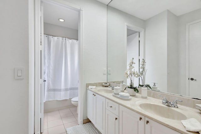 full bathroom featuring toilet, vanity, tile patterned floors, and shower / bathtub combination with curtain