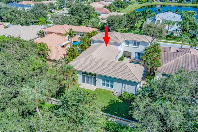 birds eye view of property featuring a water view